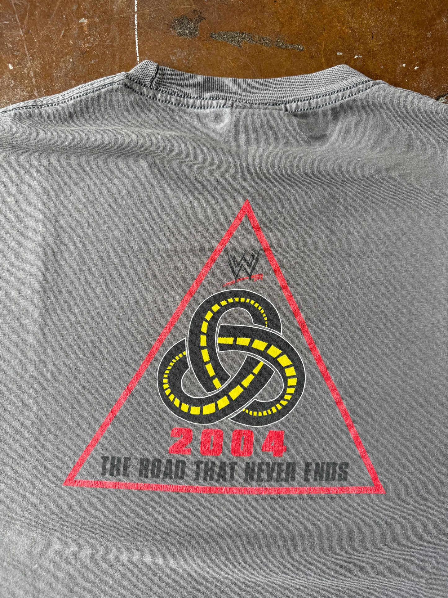 2004 lightly faded WWE production team "road that never ends" shirt (XL)