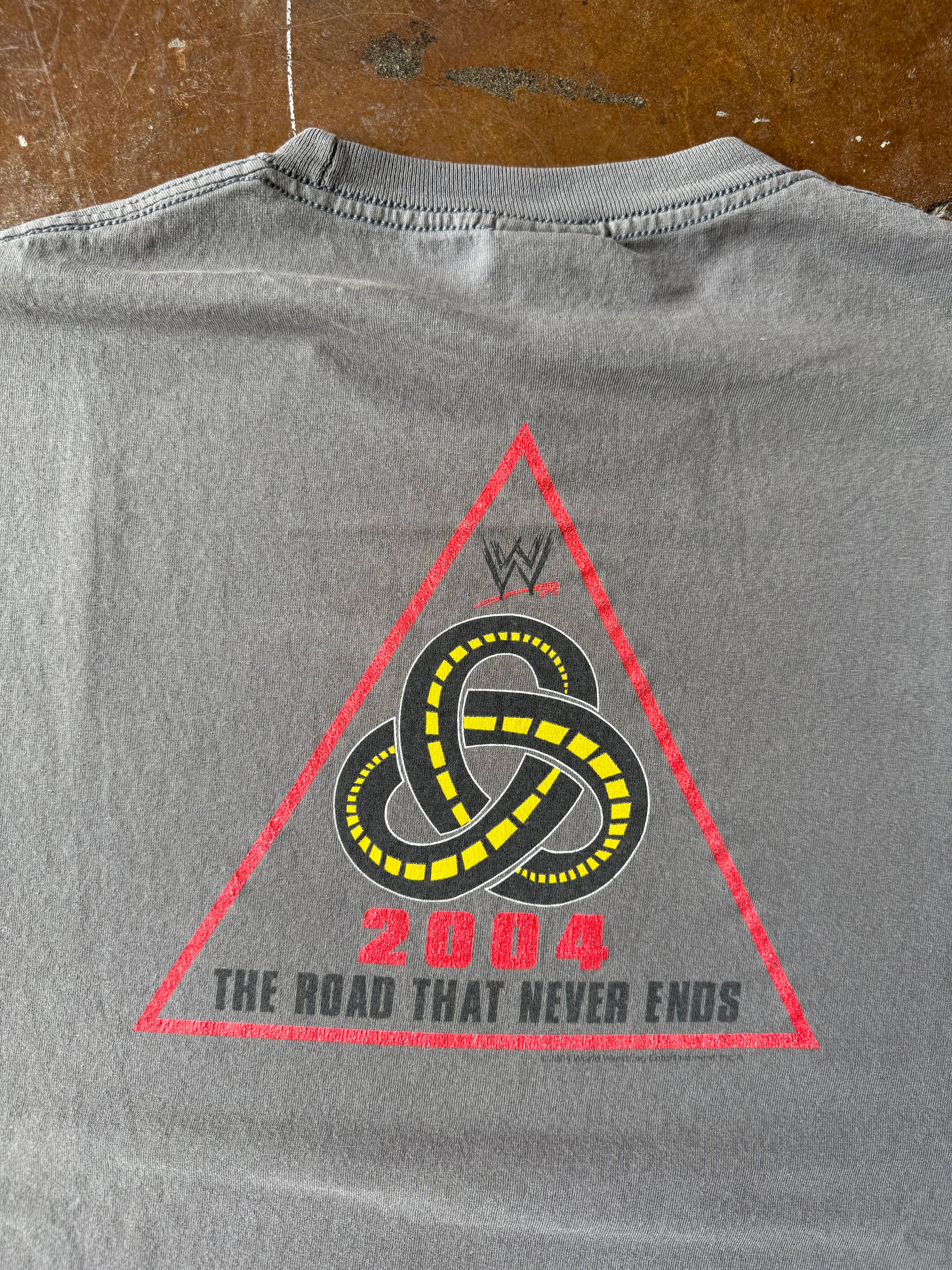 2004 lightly faded WWE production team "road that never ends" shirt (XL)